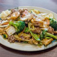125. Triple Delights · House specialty, combination of chicken, beef and shrimp mixed with broccoli, snow peas, bam...