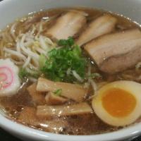 Pork Shoyu Ramen · Light soy sauce and chicken broth with wavy egg noodle topped with roast pork (charshu), bam...