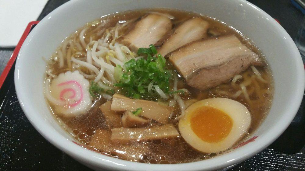 Pork Shoyu Ramen · Light soy sauce and chicken broth with wavy egg noodle topped with roast pork (charshu), bamboo shoot, bean sprout, scallion, fish cake and seasoned boiled egg.