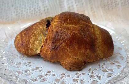 Chocolate Croissant · A classic buttery, flaky pastry with a chocolate filling. 