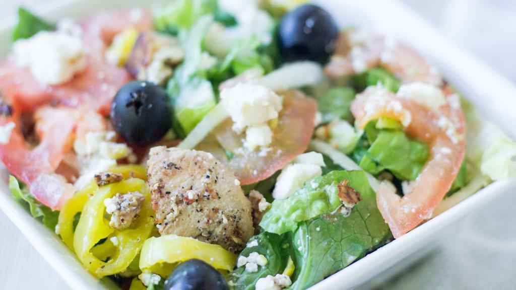 Grilled Chicken Greek Salad · Lettuce, tomato, onions, green peppers, black olives, cucumbers, feta cheese with Greek dressing and grilled chicken.