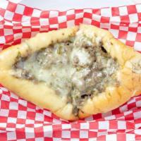 Philly Cheesesteak Sub · Grilled steak with onions, mushrooms and peppers topped with melted provolone cheese and mayo.