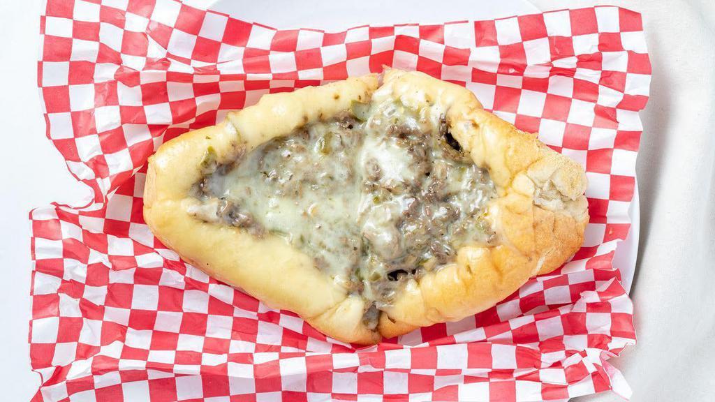 Philly Cheese Steak Sub · Grilled steak with onions, mushrooms and peppers topped with melted provolone cheese and mayo.