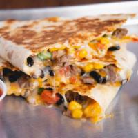 Build Your Own Quesadilla · Add guacamole or queso for an additional charge.