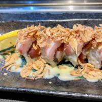 Yummy Yummy · Tuna,salmon,masago topped w.sliced yellowtail,fried onion,honey wasabi mayo