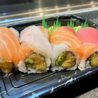 Sakura Roll · Spicy white tuna and avocado topped with tuna, salmon and spicy mayo sauce. Six to eight pie...