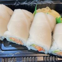 Snow White Roll · Spicy crab meat, avocado and crunchy topped with white tuna. Six to eight piece.
