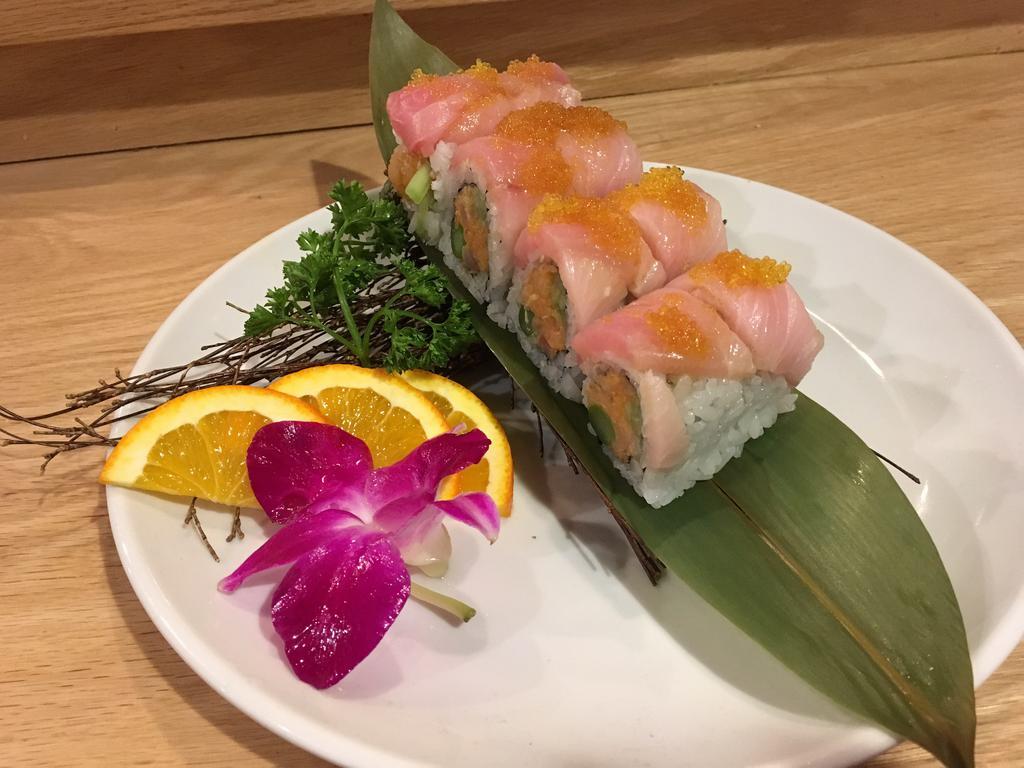 R26. Yellowtail Lover Roll · Spicy yellowtail, cucumber, asparagus, fresh yellowtail on top, green onion, yuzu tobiko served with yuzu sauce on the side.
