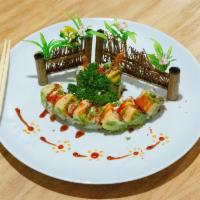 R40. Cherry Blossom Roll · Tempura shrimp, cream cheese, crab meat top with avocado sheet, lobster salad, red tobiko, g...