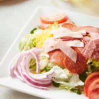 Antipasto Salad · A fresh blend of iceberg and spinach, topped with ham, pepperoni, salami, green and black ol...
