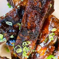 Crispy Fried Ribs (6 count) · Single bone spare ribs, smoked, fried, and dipped in an ale BBQ sauce