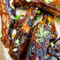 Crispy Fried Ribs (12 count) · Single bone spare ribs, smoked, fried, and dipped in an ale BBQ sauce