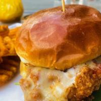 Nashville Fried Chicken Sandwich · 2 fried chicken breasts, red onion, house
made pickles, hot sauce, ghost pepper cheese, aru...
