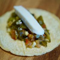 Taco Rajas · Poblano peppers, corn, tomato and onion. Served with fresh cheese. For vegan option, hold th...