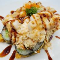 Baked Dynamite Roll · Crab meat, avocado, cucumber and gobo inside. Scallop, mushroom and onion outside. Baked.