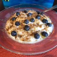 Healthy Bowl · Vanilla Greek yogurt topped with honey, granola and fresh blueberries.