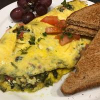Garden Omelette · Fluffy three egg omelette stuffed with baby spinach, roasted red peppers, green peppers red ...