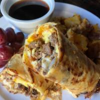 Breakfast Burrito · Juicy grilled rib eye and onions with Swiss cheese, drizzled with spicy jumpin' sauce. Wrapp...