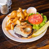 Black Bean Burger · Black bean burger topped with lettuce, tomato, crispy onion rings, and Swiss on a brioche bu...