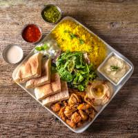 Protein Plate · With your choice of protein, the plate comes with turmeric rice, pita bread, hummus, tzatzik...