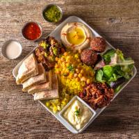 Vegan Plate · Plate comes with falafel, turmeric rice, pita bread, sumac cauliflower, eggplant ragout, gar...
