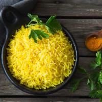Turmeric Rice · Fluffy yellow rice.