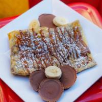 Reese's Crepe · Reese's Pieces, banana, milk chocolate, peanut butter and vanilla ice cream.