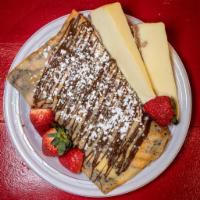 Cheesecake Crepe with New York Cheesecake, Fresh Strawberries, Any Chocolate and Whipped Cream. · 