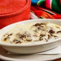 Queso Flameado · Melted Monterrey cheese with a choice of chorizo, chicken, fajita or shrimp fajitas. Served ...