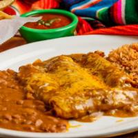 Enchilada Dinner · 3 ground beef, shredded chicken or cheese enchiladas covered with gravy and cheese. 