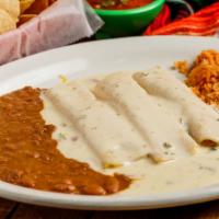 Enchiladas White Queso · 3 shredded chicken enchiladas covered with jalapeno white queso sauce.