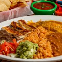 Tex-Mex Combo · Chicken and beef fajita steak, served with 1 cheese enchilada, rice, beans, guacamole and to...