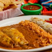 El Grande · 1 chicken fajita taco, 1 beef enchilada, 1 tamale covered with gravy and cheese, served with...