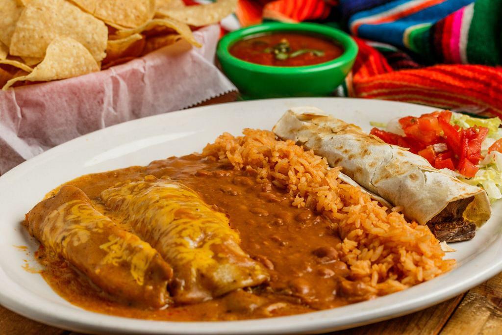 El Grande · 1 chicken fajita taco, 1 beef enchilada, 1 tamale covered with gravy and cheese, served with rice and beans.