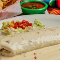White Queso Donkey · Large flour tortilla stuffed with grilled chicken, beans and rice, topped with jalapeno whit...