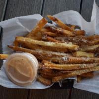 Garlic Parmesan Fries · Tossed in garlic and grated Parmesan and served with a lighthouse dipping sauce. Fried in pe...