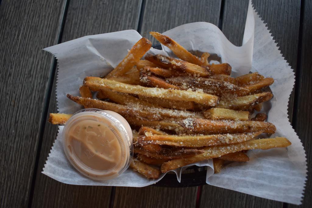 Garlic Parmesan Fries · Tossed in garlic and grated Parmesan and served with a lighthouse dipping sauce. Fried in peanut oil.