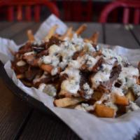 Beef & Blue Fries · Salted then topped with brisket and blue cheese crumbles with a Parmesan peppercorn sauce dr...