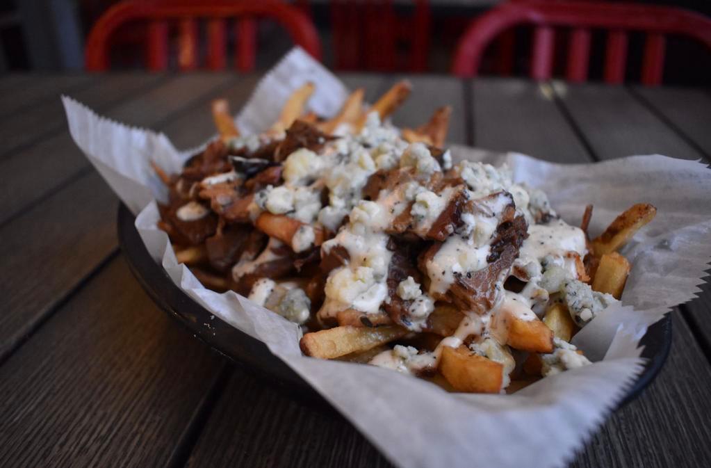 Beef & Blue Fries · Salted then topped with brisket and blue cheese crumbles with a Parmesan peppercorn sauce drizzle. Fried in peanut oil.