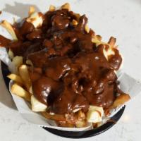 Poutine Fries · Salted then topped with cheese curds and smothered in brown gravy. Fried in peanut oil.