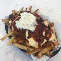 Outlaw Fries · Salted then topped with pulled pork, cheddar Jack cheese sauce and coleslaw with a BBQ sauce...