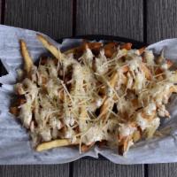 Truffle Fries · Tossed in truffle oil then topped with shredded Parmesan cheese and a Parmesan peppercorn sa...