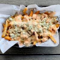 Tiger Fries · Tossed in Buffalo seasoning then topped with roast chicken, blue cheese crumbles, and chedda...