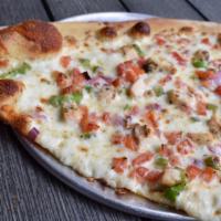 El Classico Slice · Roast chicken, green peppers, onions, and tomatoes with a cilantro-lime ranch sauce drizzle.