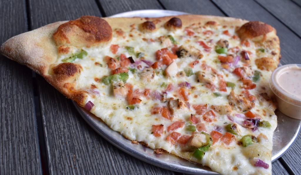 El Classico Slice · Roast chicken, green peppers, onions, and tomatoes with a cilantro-lime ranch sauce drizzle.
