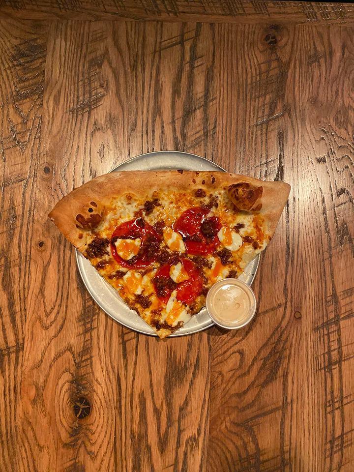 The Sparky Slice · Pepperoni, sausage, and cream cheese crumble with a sparky sauce drizzle. A sweet and tangy hot sauce.