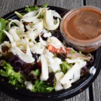 Side Salad · Arcadian lettuce topped with black olives, tomatoes, and mozzarella cheese.