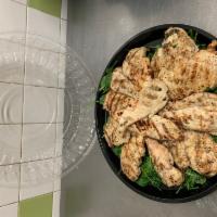 Grilled Chicken Breast Platter · 12 piece served on a bed of sauteed greens