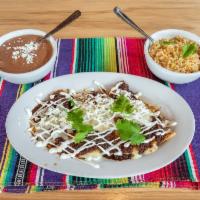 Kids Cheese Enchilada · 1 Cheese enchilada topped with queso, served with rice