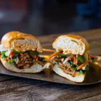 Pork Belly Banh Mi · Roasted pork belly, pickled veggies, diced cucumbers, cilantro, jalapenos, Sriracha mayo and...